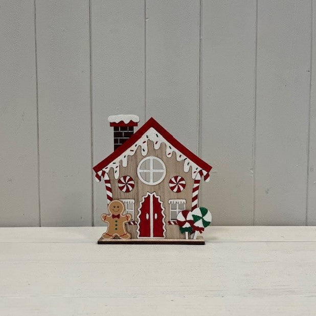Gingerbread House With Candy Cane And Sprinkles