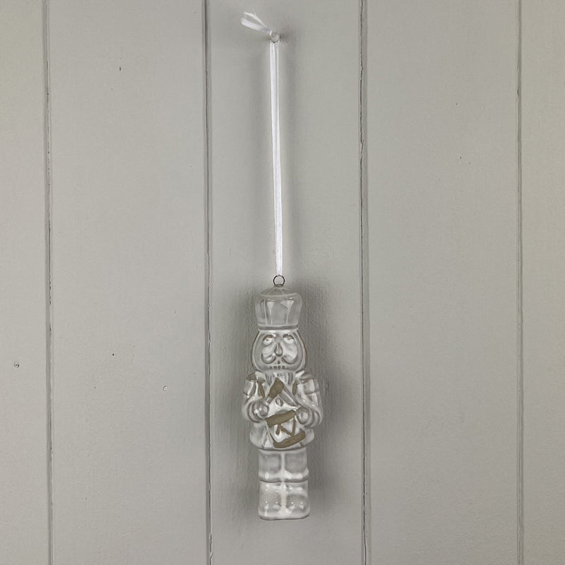 Glazed Ceramic Nutcracker Ornament With Textured Detail