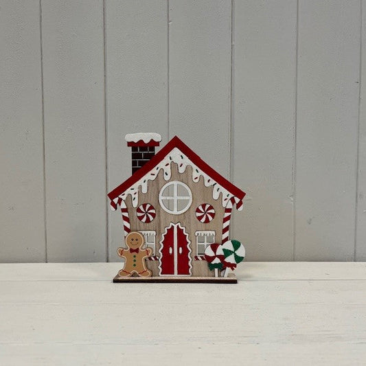 Gingerbread House With Candy Cane And Sprinkles