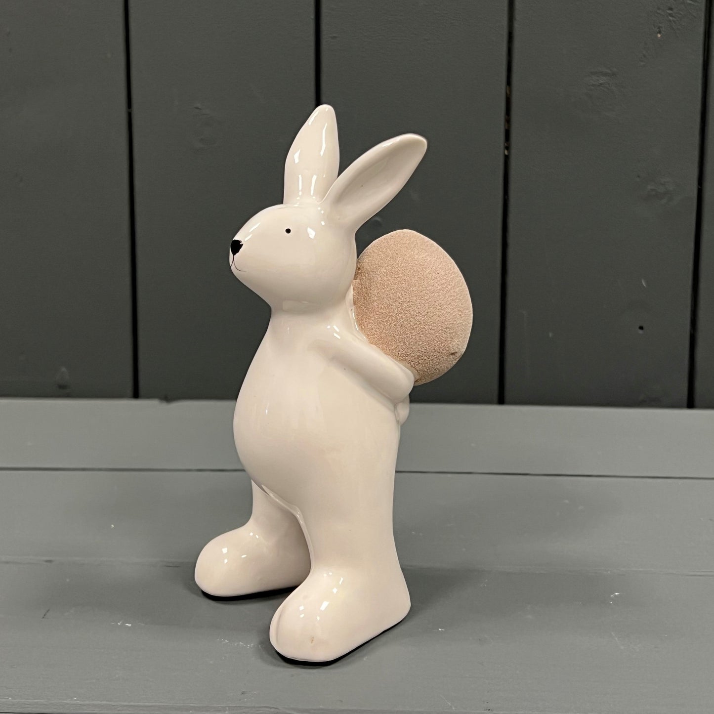 Ceramic White Rabbit holding an Egg