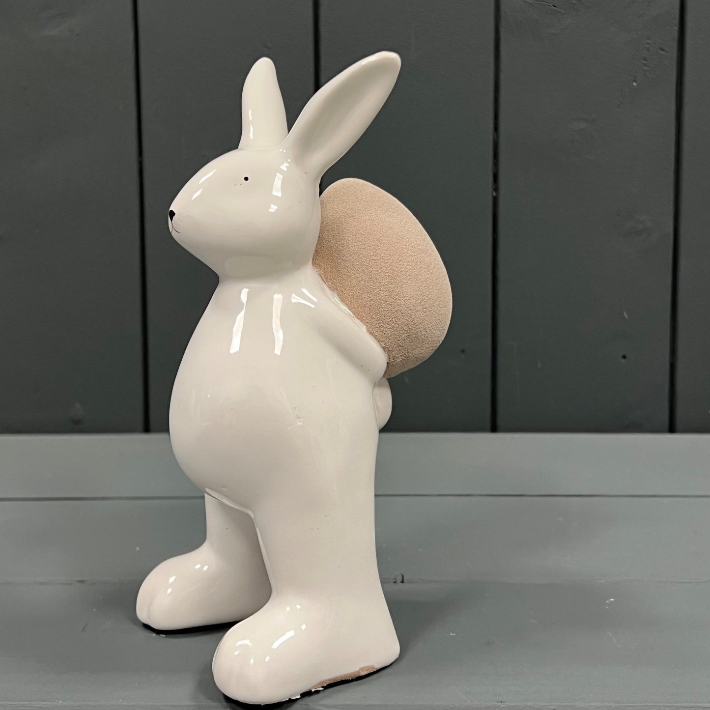 Ceramic White Rabbit holding an Egg