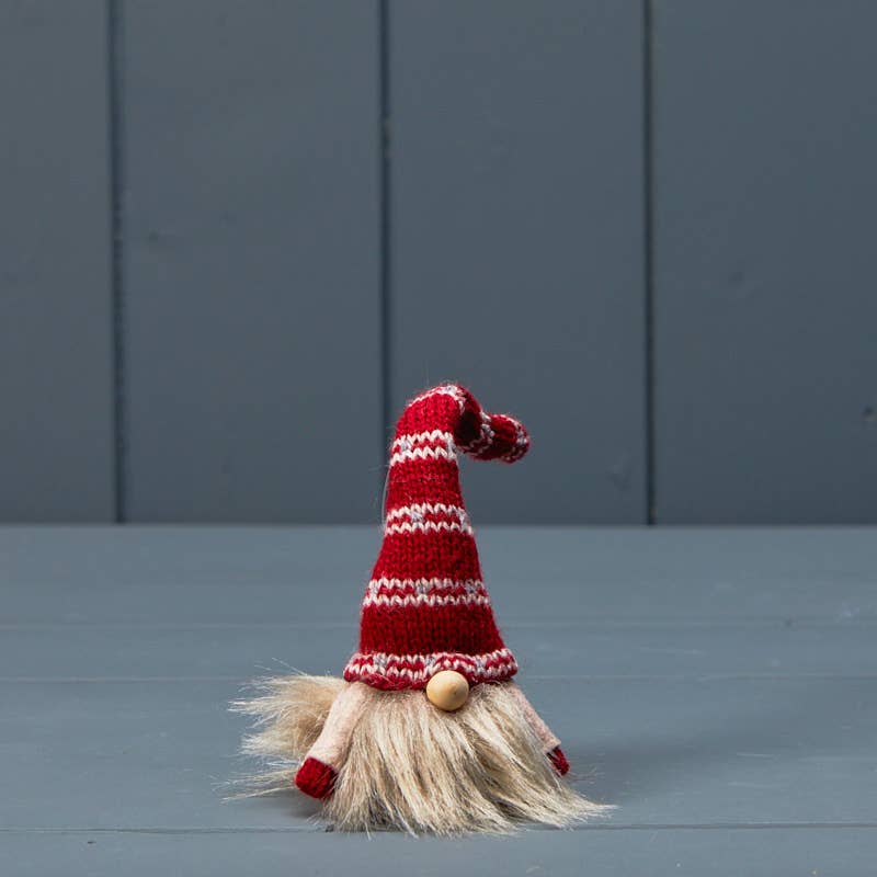 White Knitted Gonk With Red And White Patterned Hat