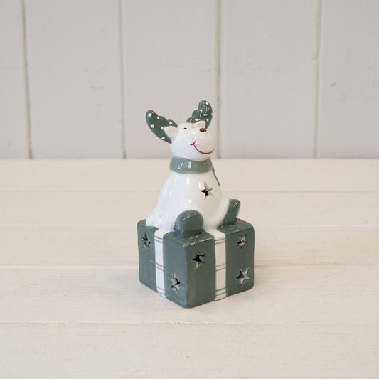 Nordic Green Reindeer sitting on LED Present