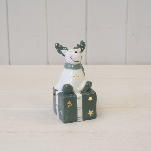 Nordic Green Reindeer sitting on LED Present