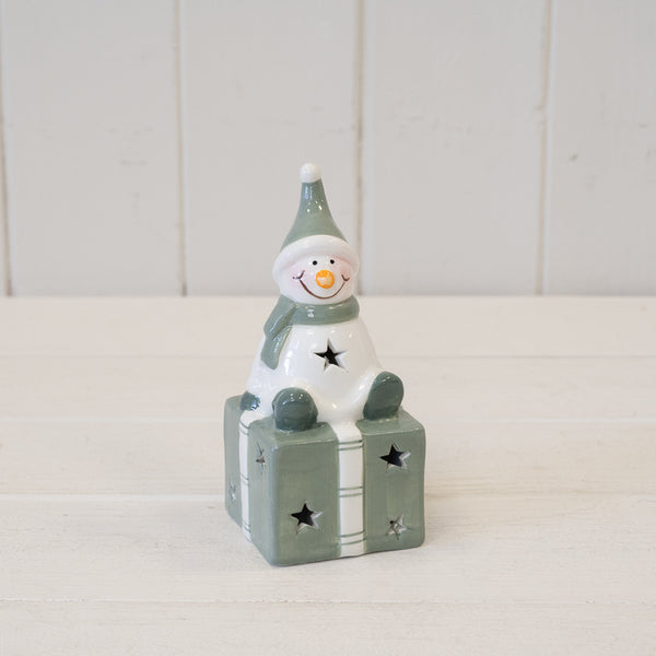 Nordic Green Snowman sitting on LED Present