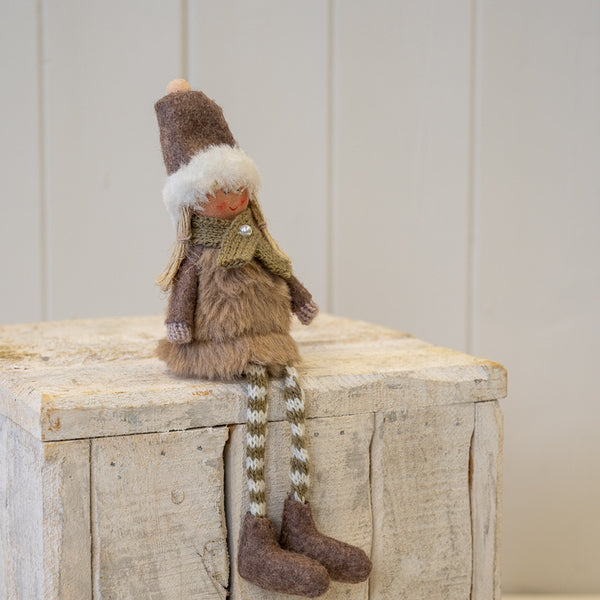 Fabric Sitting Girl in Brown Outfit